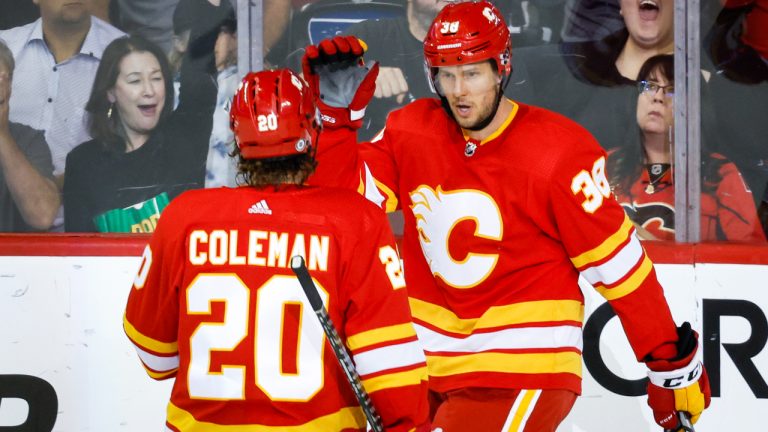 Calgary Flames centre Brett Sutter, right, celebrates his goal with teammate forward Blake Coleman during second period NHL pre-season hockey action against the Edmonton Oilers in Calgary, Wednesday, Sept. 28, 2022. (Jeff McIntosh/CP)