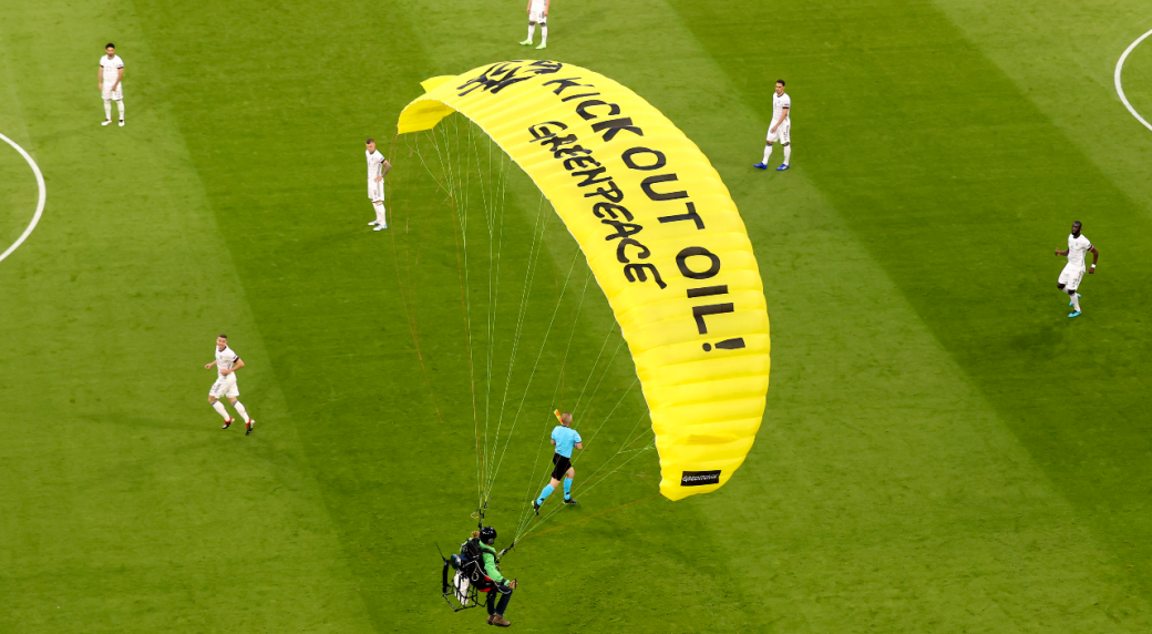 Activists fined for crash-landing a parachute in stadium before Germany-France match