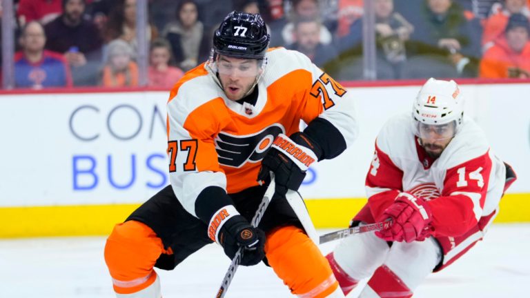 Philadelphia Flyers' Tony DeAngelo, left, tries to keep away from Detroit Red Wings' Robby Fabbri during the first period of an NHL hockey game, Sunday, March 5, 2023, in Philadelphia. (Matt Slocum/AP) 