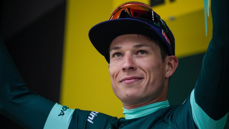 Netherlands' Fabio Jakobsen, wearing the best sprinter's green jersey, celebrates on the podium after the fifth stage of the Tour de France cycling race over 163 kilometers (101 miles) with start in Pau and finish in Laruns, France, Wednesday, July 5, 2023. (AP Photo/Daniel Cole)