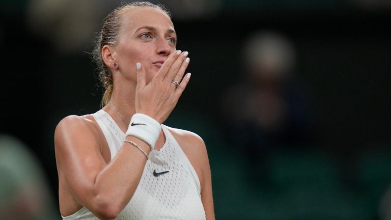 Czech Republic's Petra Kvitova celebrates defeating Italy's Jasmine Paolini in the women's singles match on day three of the Wimbledon tennis championships in London, Wednesday, July 5, 2023. (AP Photo/Alastair Grant)