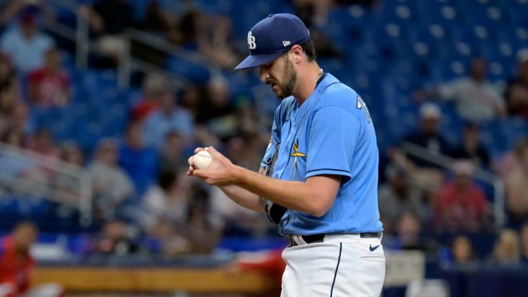 Tampa Bay Rays reliever Ryan Thompson rubs a new ball after giving up two go-ahead runs during the 11th inning of a baseball game against the Philadelphia Phillies, Thursday, July 6, 2023, in St. Petersburg, Fla. (Steve Nesius/AP)