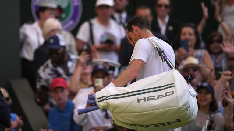 Britain's Andy Murray leaves the court after losing to Stefanos Tsitsipas of Greece in a men's singles match on day five of the Wimbledon tennis championships in London, Friday, July 7, 2023. (Alberto Pezzali/AP)