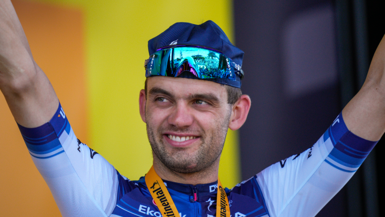 Stage winner Denmark's Kasper Asgreen celebrates on the podium after the eighteenth stage of the Tour de France cycling race over 185 kilometers (115 miles) with start in Moutiers and finish in Bourg-en-Bresse, France, Thursday, July 20, 2023. (AP)