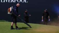 Environmental activists disrupt play at Open Championship