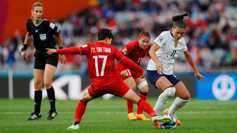 United States' Sophia Smith battles for the ball with Vietnam's Thi Thu Thao Tran (17) and Thi Thao Thai as referee Bouchra Karboubi, of Morocco, looks on during the Women's World Cup Group E soccer match between the United States and Vietnam at Eden Park in Auckland, New Zealand, Saturday, July 22, 2023. (Abbie Parr/AP) 