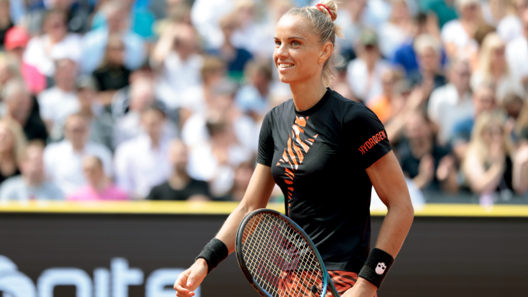 Netherlands' Arantxa Rus celebrates a point as she plays Germany's Noma Noha Akugue, during the Women's single final tennis match of the Hamburg European Open WTA Tournament, at the Rothenbaum Tennis Stadium, in Hamburg, Germany, Saturday, July 29, 2023. (AP)