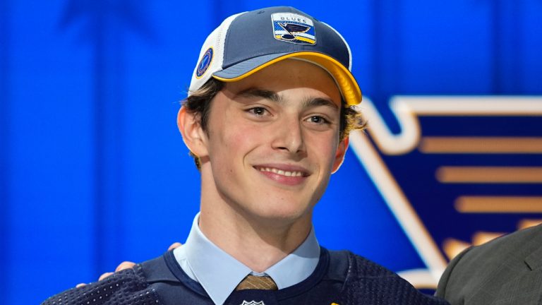 Dalibor Dvorsky poses on stage after being picked by the St. Louis Blues during the first round of the NHL hockey draft Wednesday, June 28, 2023, in Nashville, Tenn. (George Walker IV/AP)