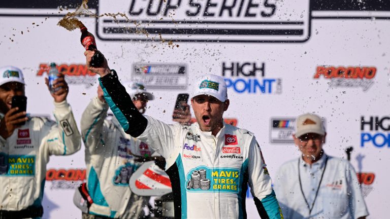 Denny Hamlin celebrates in Victory Lane after winning a NASCAR Cup Series auto race at Pocono Raceway, Sunday, July 23, 2023, in Long Pond, Pa. (Derik Hamilton/AP)