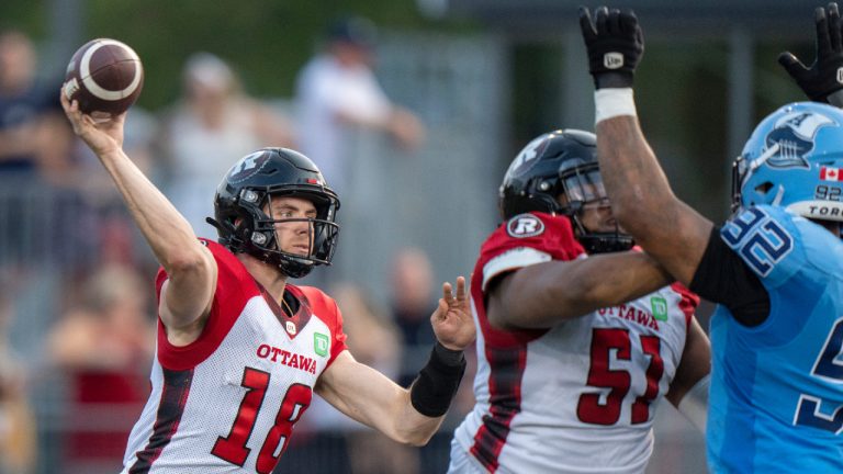 Ottawa Redblacks quarterback Dustin Crum (18) launches a pass from the pocket during first half CFL pre-season action against the Toronto Argonauts in Guelph, Ont. on Thursday, June 1, 2023. (Frank Gunn/CP)