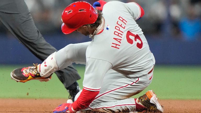 Philadelphia Phillies' Bryce Harper (3) is safe at second with a double during the first inning of a baseball game against the Miami Marlins, Saturday, July 8, 2023, in Miami. (Lynne Sladky/AP)