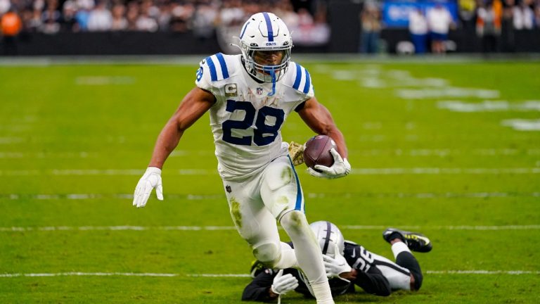 Indianapolis Colts running back Jonathan Taylor (28) gets past Las Vegas Raiders cornerback Rock Ya-Sin (26) in the first half of an NFL football game in Las Vegas, Sunday, Nov. 13, 2022. (Matt York/AP)