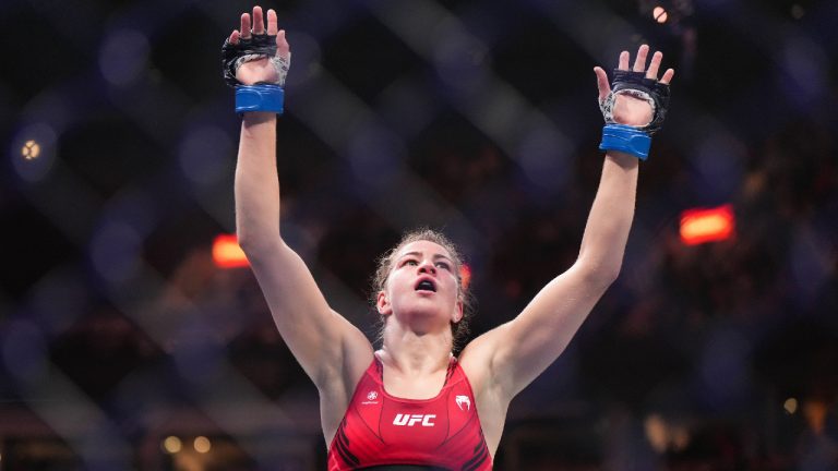 Jasmine Jasudavicius celebrates after her fight against Miranda Maverick during a UFC 289 women's flyweight bout, in Vancouver, on Saturday, June 10, 2023. (Darryl Dyck/CP)