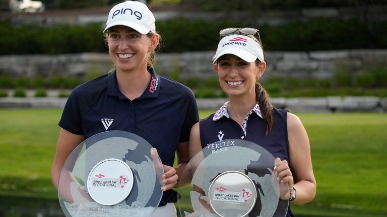 Elizabeth Szokol, left, and Cheyenne Knight hold the winners trophy after the final round of the Dow Great Lakes Bay Invitational golf tournament at Midland Country Club, Saturday, July 22, 2023, in Midland, Mich. (Carlos Osorio/AP)