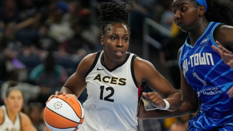 Las Vegas Aces guard Chelsea Gray, left, dribbles the ball around Chicago Sky center Elizabeth Williams during the second half of a WNBA basketball game Tuesday, July 25, 2023, in Chicago. The Aces won 107-95. (Erin Hooley/AP)