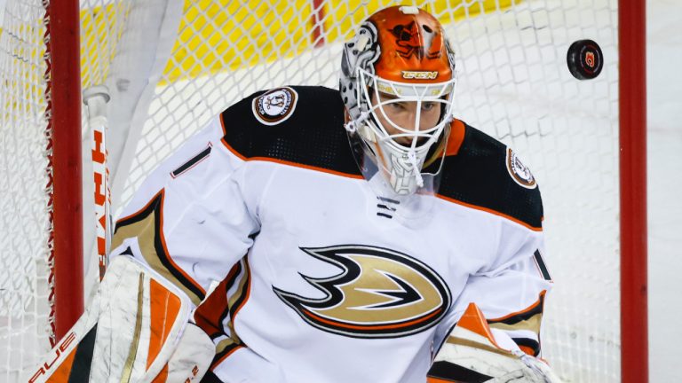 Anaheim Ducks goalie Lukas Dostal keeps his eyes on the puck during first period NHL hockey action against the Calgary Flames in Calgary, Sunday, April 2, 2023.(Jeff McIntosh/CP)