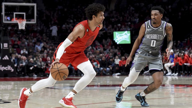 Portland Trail Blazers guard Matisse Thybulle, left, drives to the basket against Sacramento Kings guard Malik Monk, right, during the second half of an NBA basketball game in Portland, Ore., Wednesday, March 29, 2023. The Kings won 120-80. (Steve Dykes/AP)