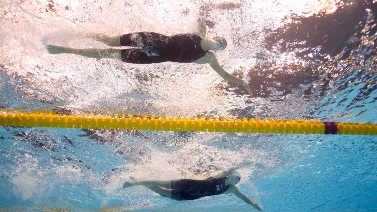 Summer McIntosh, top, of Canada, and Katie Ledecky, of the United States, compete in the women's 400m freestyle at the World Swimming Championships in Fukuoka, Japan, Sunday, July 23, 2023. (David J. Phillip/AP)