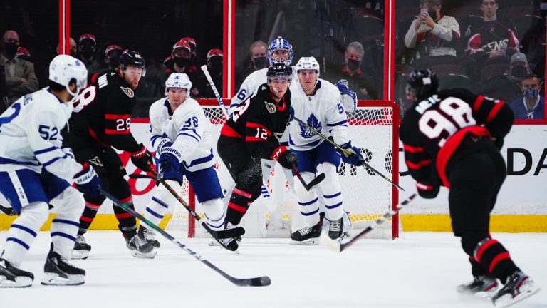 Ottawa Senators' Victor Mete (98) lets a shot go on Toronto Maple Leafs' Jack Campbell (36) as Leaf's Noel Hoefenmayer (57) defends and Sen's Shane Pinto (12) looks on during first period pre-season NHL action in Ottawa on Monday, Oct. 4, 2021. (Sean Kilpatrick/CP)