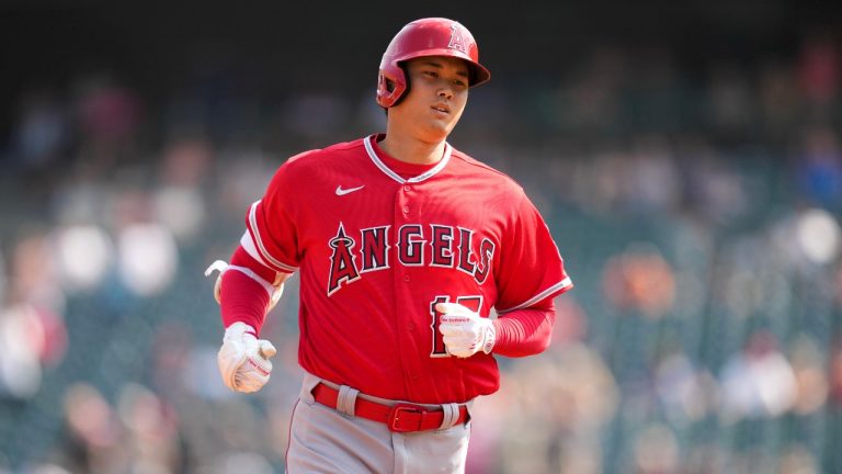 Los Angeles Angels' Shohei Ohtani rounds third base after hitting a two-run home run against the Detroit Tigers in the second inning during the second baseball game of a doubleheader. (AP Photo/Paul Sancya)