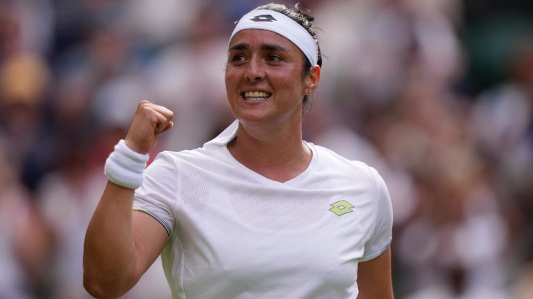 Tunisia's Ons Jabeur celebrates after beating Czech Republic's Petra Kvitova in a women's singles match on day eight of the Wimbledon tennis championships in London, Monday, July 10, 2023. (AP)