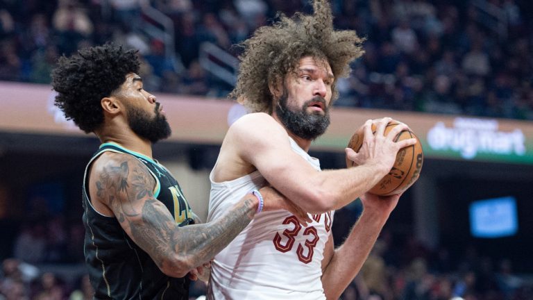 Cleveland Cavaliers' Robin Lopez (33) is defended by Charlotte Hornets' Nick Richards (4) during the first half of an NBA basketball game. (Phil Long/AP)