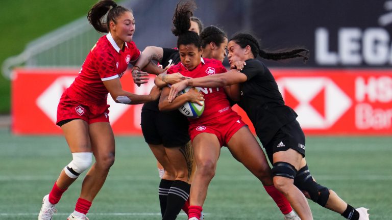 Canada's Fancy Bermudez (centre) is tackled by New Zealand's Kennedy Simon (7) right, and Katelyn Vahaakolo (11) during second half rugby action at the Pacific Four Series in Ottawa on Saturday, July 8, 2023. (Sean Kilpatrick/CP)