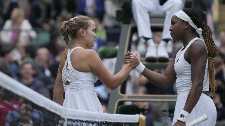 Sofia Kenin of the US, left, shakes hands with Coco Gauff of the US after winning the first round women's singles match on day one of the Wimbledon tennis championships in London, Monday, July 3, 2023. (Alastair Grant/AP)