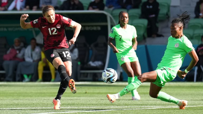 Canada's Christine Sinclair, left, shoots as Nigeria's Osinachi Ohale defends during first half Group B soccer action at the FIFA Women's World Cup in Melbourne, Australia, Friday, July 21, 2023. (Scott Barbour/CP)