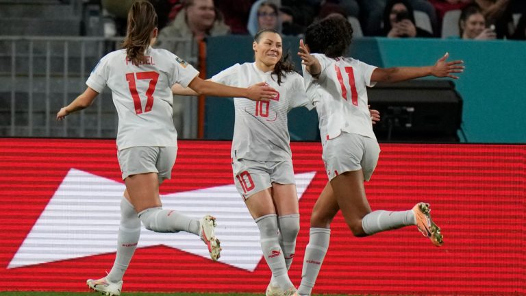 Switzerland's Ramona Bachmann, center, celebrates her penalty kick goal with Seraina Piubel, left, and Coumba Sow during the first half of the Women's World Cup Group A soccer match between the Philippines and Switzerland in Dunedin, New Zealand, Friday, July 21, 2023. (Alessandra Tarantino/AP)