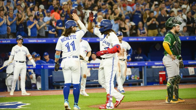 Toronto Blue Jays' Vladimir Guerrero Jr. (right) celebrates with Bo Bichette (11) after hitting a three-run home run during third inning MLB baseball action against the Oakland Athletics, in Toronto on Friday, June 23, 2023. (CP)