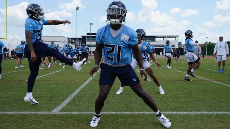 Tennessee Titans cornerback Roger McCreary (21) warms up with teammates during NFL football practice Wednesday, May 31, 2023, in Nashville, Tenn. (George Walker IV/AP)