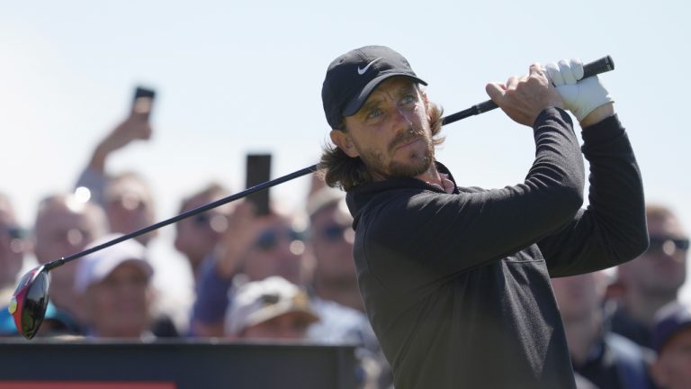 England's Tommy Fleetwood plays his tee shot on the 12th hole during a practice round for the British Open Golf Championships at the Royal Liverpool Golf Club in Hoylake, England, Wednesday, July 19, 2023. The Open starts Thursday, July 20. (AP Photo/Kin Cheung)