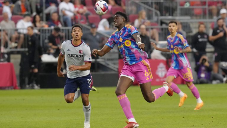 St. Louis City's Nicholas Gioacchini (left) battles for the ball with Toronto FC's Aime Mabika during first half MLS action in Toronto, on Saturday, July 8, 2023. (Chris Young/CP)