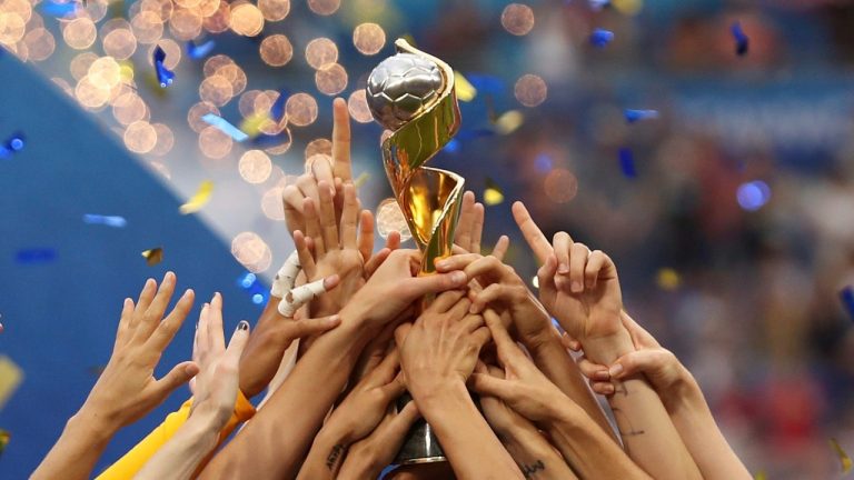 United States players hold the trophy as they celebrate winning the Women's World Cup final in 2019. (Francisco Seco/AP)