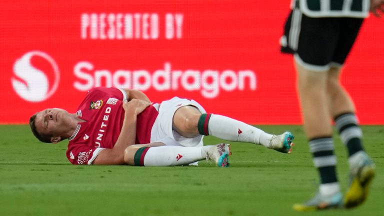 Wrexham forward Paul Mullin stays on the field after an injury during the first half of a club friendly soccer match against Manchester United, Tuesday, July 25, 2023, in San Diego. (Gregory Bull/AP)