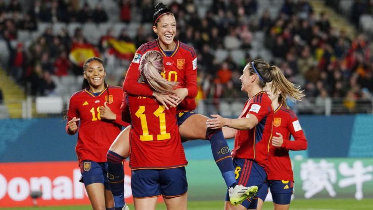 Spain's Jennifer Hermoso jumps into the arms of teammate Alexia Putellas celebrating after scoring her side's second goal during the Women's World Cup Group C soccer match between Spain and Zambia at Eden Park in Auckland, New Zealand, Wednesday, July 26, 2023. (Abbie Parr/AP)