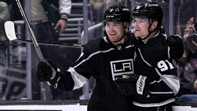 Los Angeles Kings right wing Carl Grundstrom, right, celebrates his goal against the Arizona Coyotes with defenseman Tobias Bjornfot during the second period of an NHL hockey game in Los Angeles, Thursday, Dec. 1, 2022. (Alex Gallardo/AP)