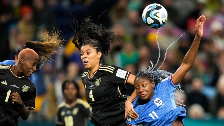 Jamaica's Deneisha Blackwood, left, heads the ball next to teammate Chantelle Swaby, center, and France's Kadidiatou Diani during the Women's World Cup Group F soccer match between France and Jamaica at the Sydney Football Stadium in Sydney, Australia, Sunday, July 23, 2023. The match ended in a 0-0 draw. (Rick Rycroft/AP)