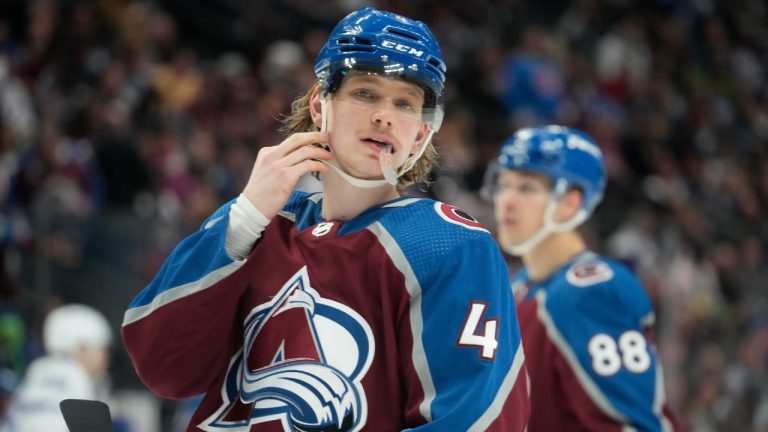 Colorado Avalanche defenseman Bowen Byram adjusts his helmet in the second period of an NHL hockey game against the Tampa Bay Lightning, Tuesday, Feb. 14, 2023, in Denver. (David Zalubowski/AP)