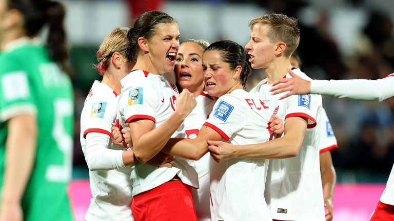 Christine Sinclair (left to right), Adriana Leon, Jessie Fleming and Quinn celebrate a second half goal by Leon against Ireland during their Group B match at the FIFA Women's World Cup. (James Worsfold/CP)