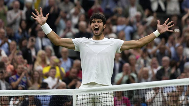 Spain's Carlos Alcaraz celebrates after beating Russia's Daniil Medvedev to win their men's singles semifinal match on day twelve of the Wimbledon tennis championships. (Alastair Grant/AP)