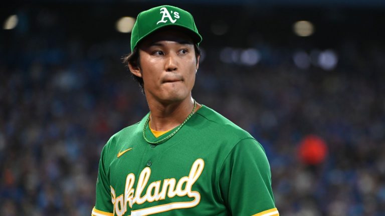 Oakland Athletics starting pitcher Shintaro Fujinami (11) leaves the field after getting pulled in first inning of American League baseball action in against the Blue Jays in Toronto on Saturday, June 24, 2023. (Jon Blacker/THE CANADIAN PRESS)