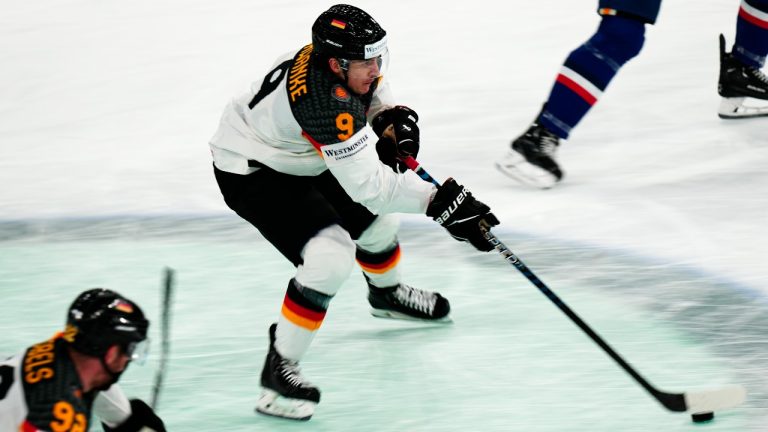 Germany's Leon Gawanke controls the puck during the group A match between Germany and France at the ice hockey world championship in Tampere, Finland, Tuesday, May 23, 2023. (Pavel Golovkin/AP Photo)