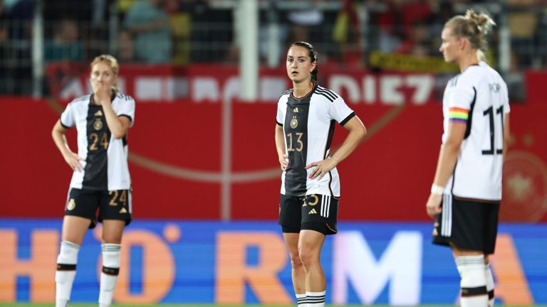 From left, Sjoeke N'sken, Sara D'britz and Alexandra Popp of Germany look dejected after Zambia scored their side's second goal during the women's international soccer match between Germany and Zambia at Sportpark Ronhof Thomas Sommer in Furth, Germany. (Daniel Karmann/AP)