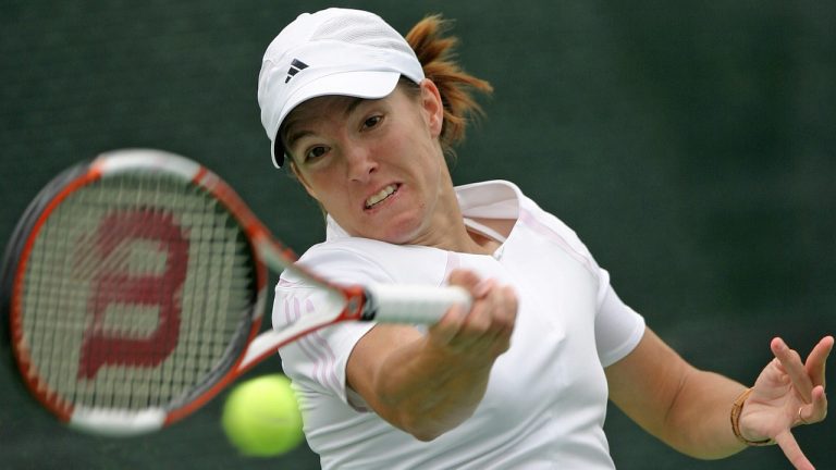 Justine Henin-Hardene, of Belgium, returns the ball to Francesca Shiavone, of Italy, during the quarterfinal match at the Duty free women's open in Dubai, UAE. Friday, Feb 24, 2006. Henin-Hardene won 6-4,7-6(7-5). (Victor Romero/AP)