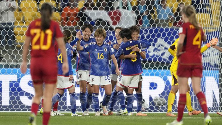 Japan's players celebrate at the end of the the Women's World Cup Group C soccer match between Japan and Spain in Wellington, New Zealand. (John Cowpland/AP)