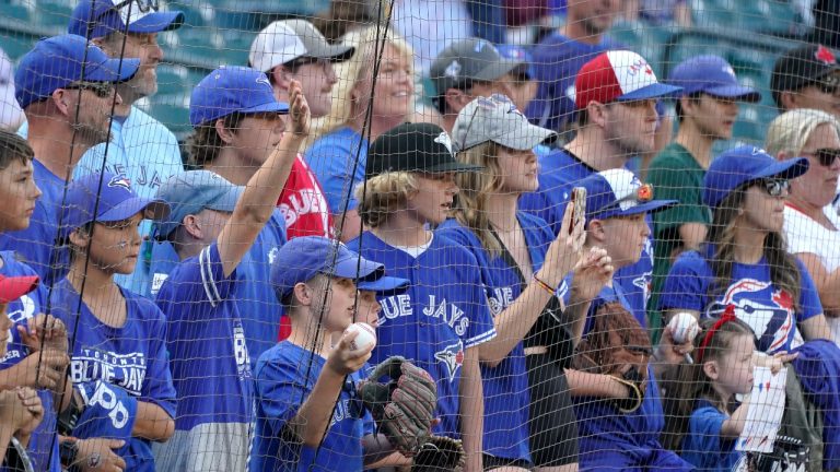 Toronto Blue Jays fans watch batting practice before the Blue Jays' baseball game against the Seattle Mariners, Thursday, July 7, 2022, in Seattle. (Ted S. Warren/AP Photo)