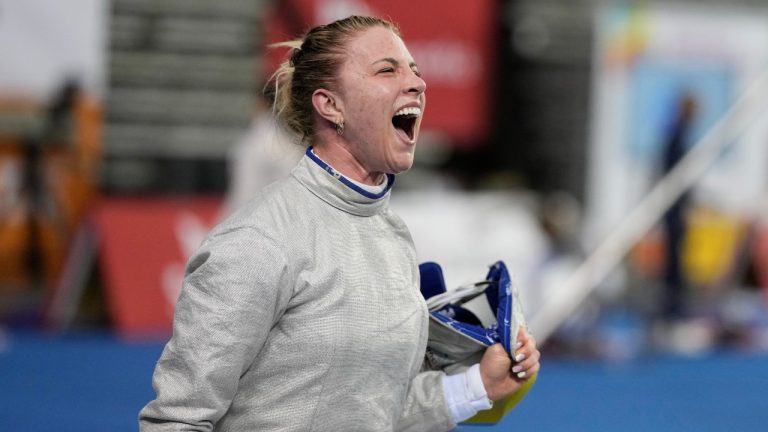 Olga Kharlan of Ukraine reacts after defeating Cyrielle Rioux of France during the women's FIE fencing sabre grand prix competition in Seoul, South Korea, Saturday, April 29, 2023. Ukraine has signaled it will no longer bar its athletes from competing against Russians who are taking part in sporting events as “neutral athletes." That would be a significant easing of its boycott policy a year before the Paris Olympics. (Lee Jin-man/AP Photo)