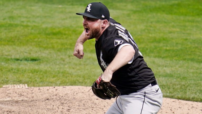 Chicago White Sox' relief pitcher Liam Hendriks celebrates the final out as he picks up the save after the White Sox beat the Minnesota Twins 2-1 in a baseball game, Wednesday, May 19, 2021, in Minneapolis. (Jim Mone/AP)